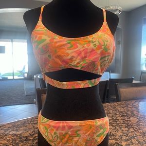 2-piece swimsuit w/orange & pink hues, crisscross tie straps. SIZE INFO IN DESC